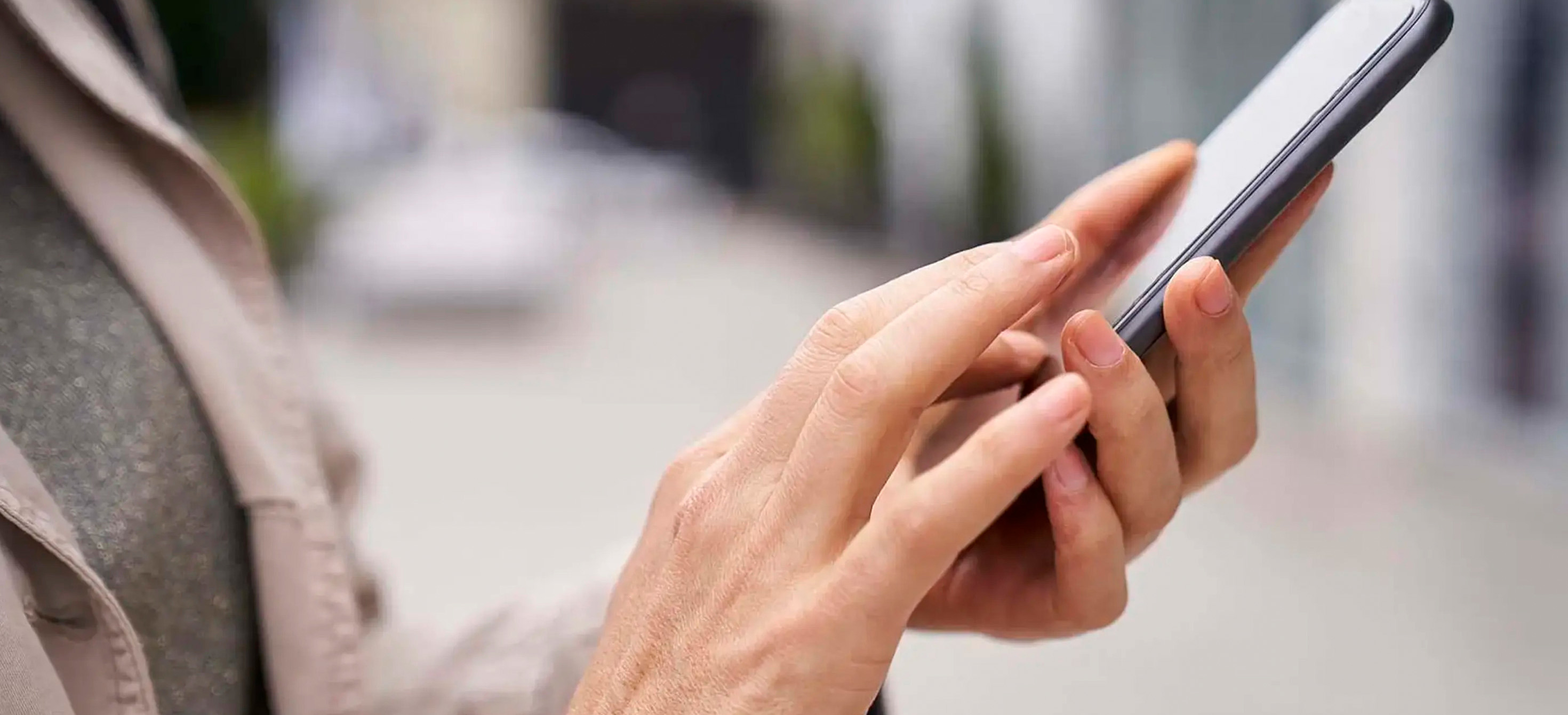 Close-up photo of hands holding a smartphone