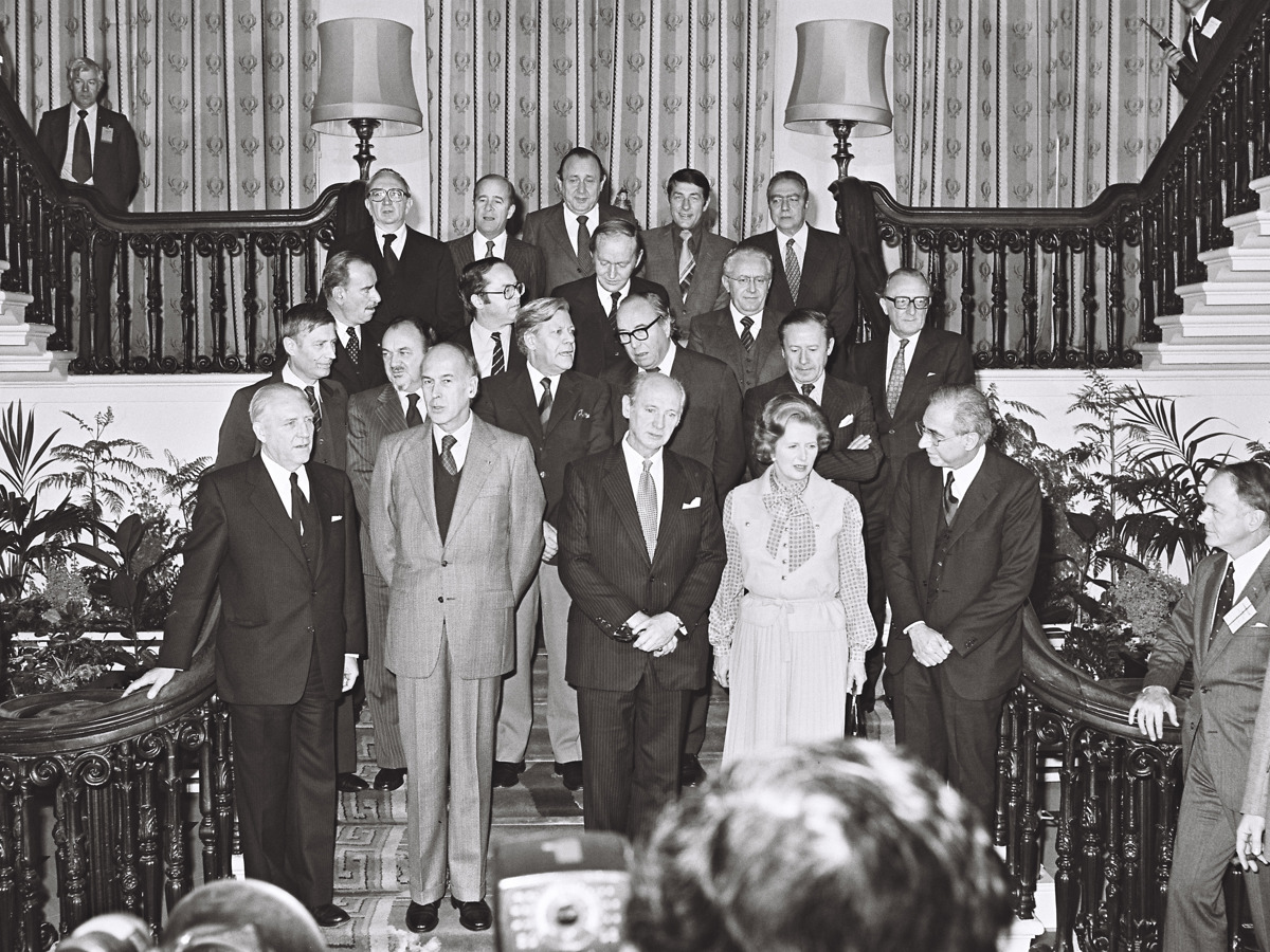 Irish and European political leaders posing for official photography on ornate staircase