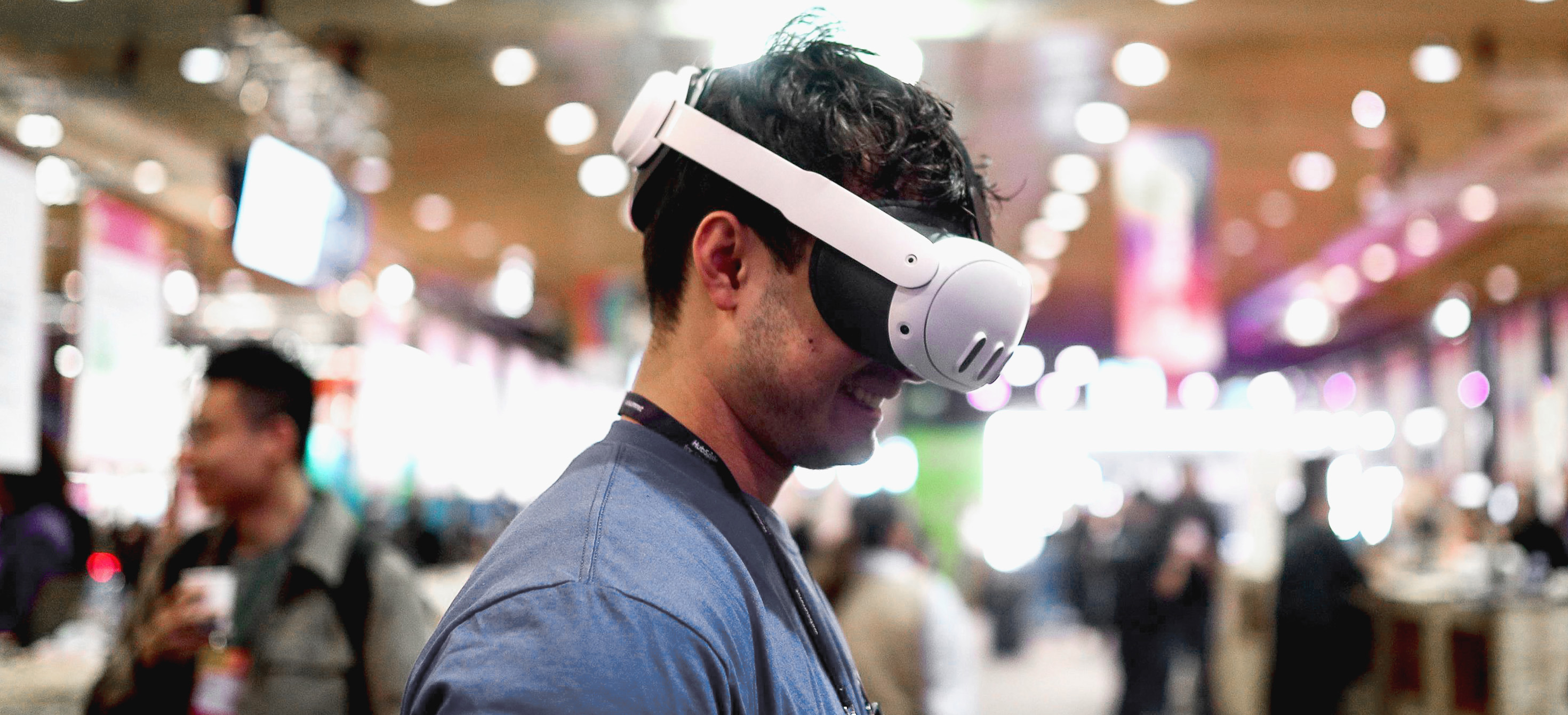 A man using a virtual reality headset in an exhibition hall