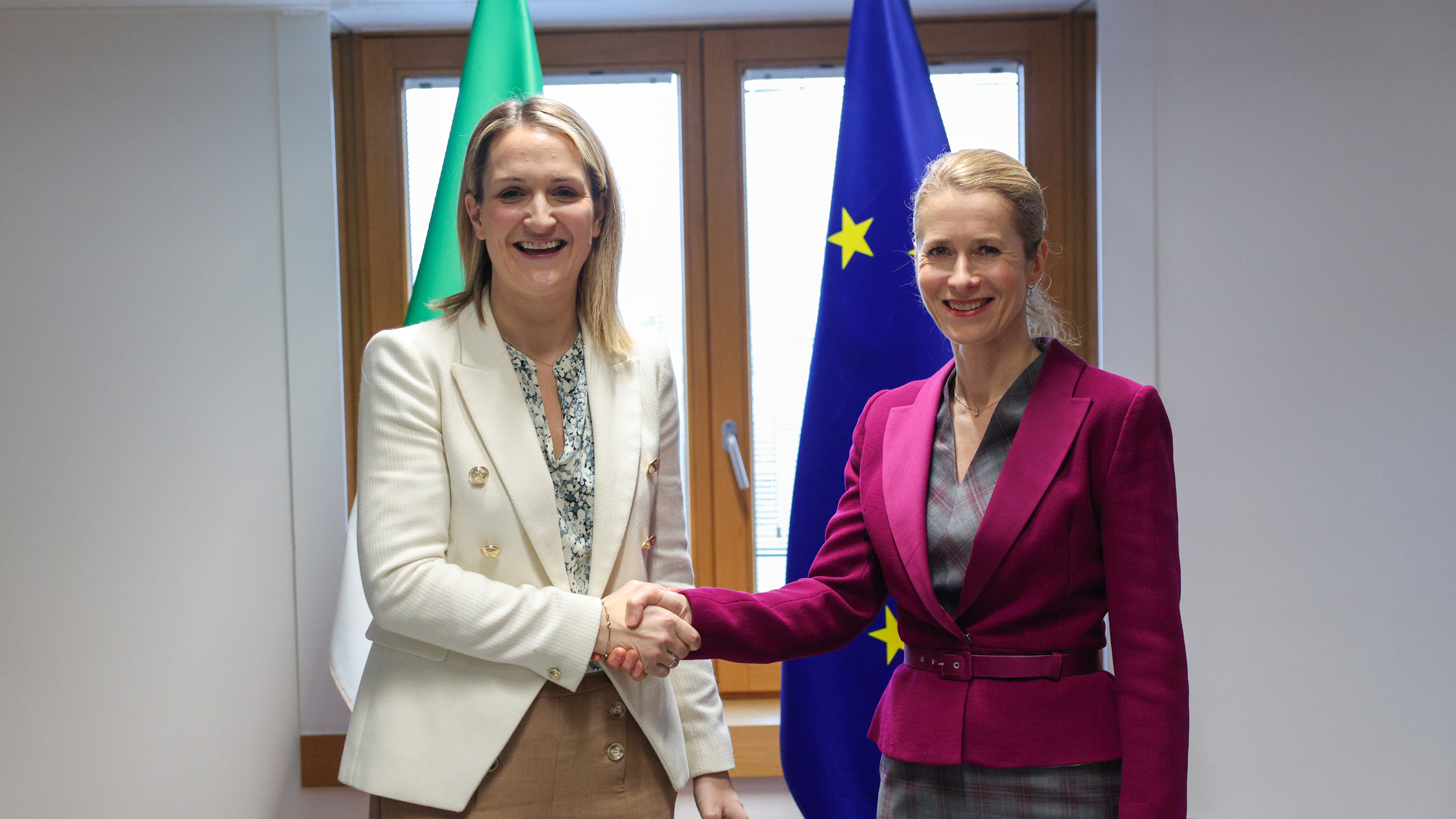 Two women shaking hands