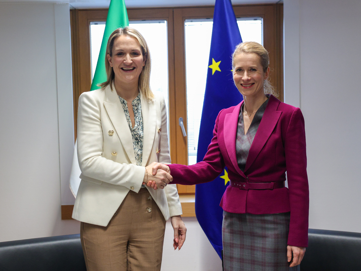 Two women shaking hands