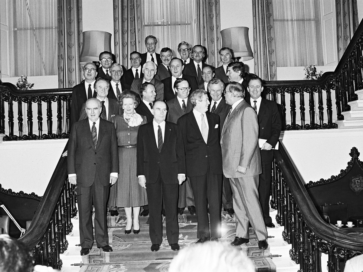 Irish and European political leaders posing for official photography on ornate staircase