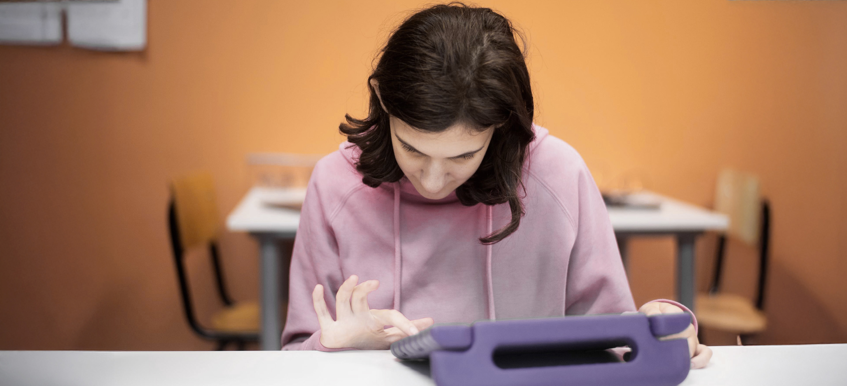 Young girl looking at a tablet