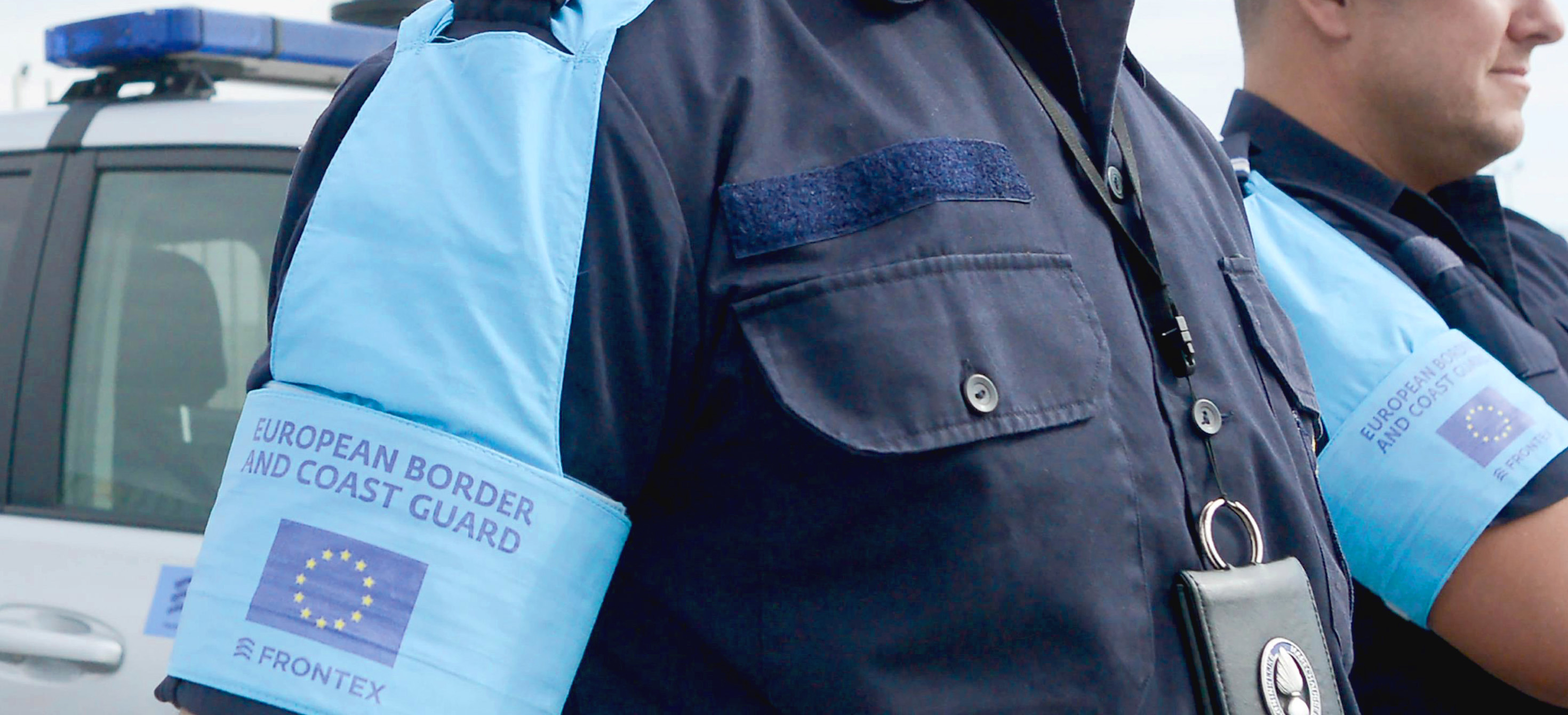 Border control agent with EU flag on their shirt sleeve
