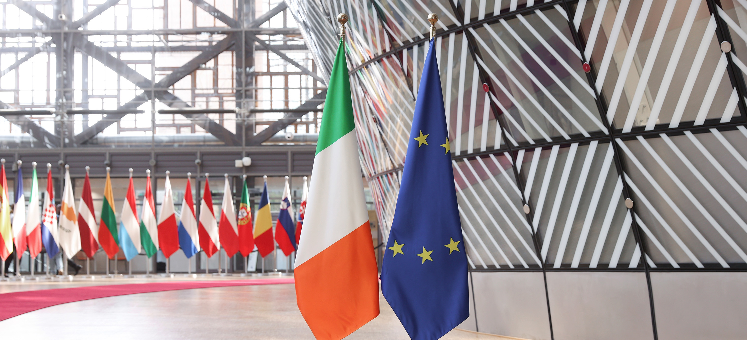 The national flag of Ireland next to the European flag