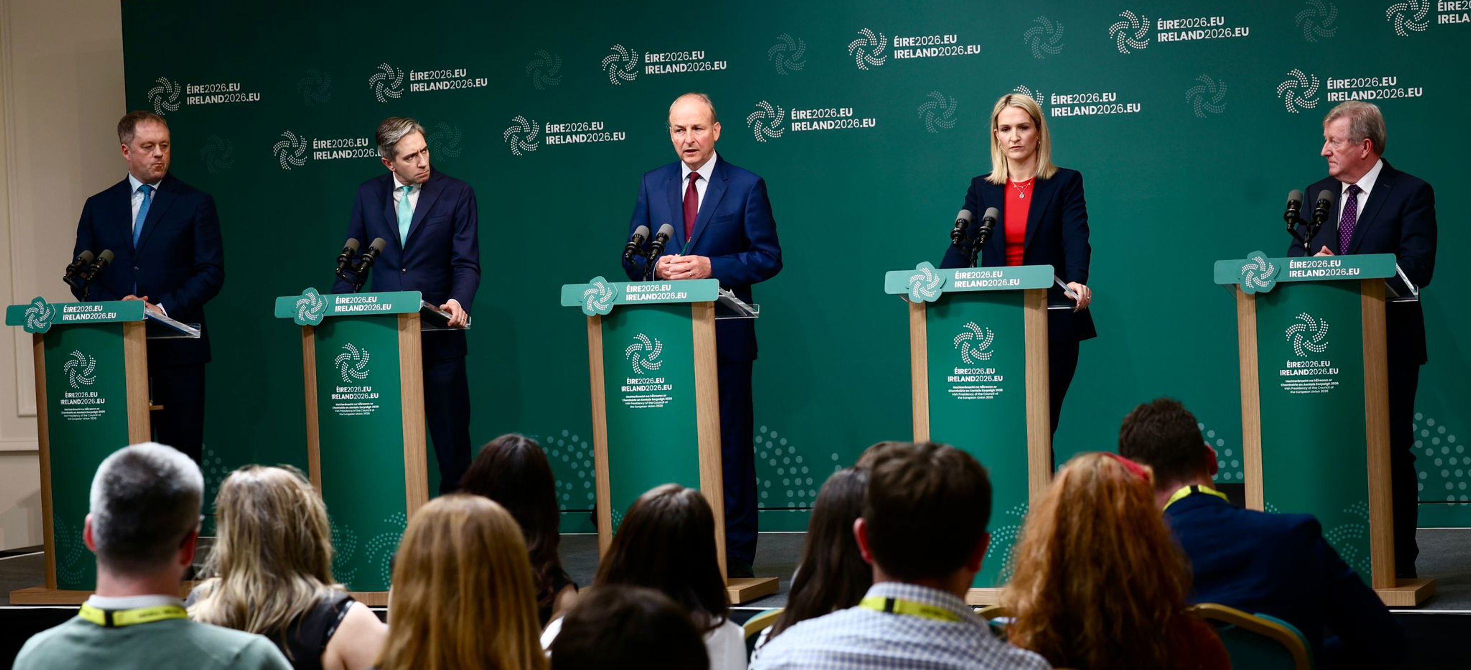 Taoiseach, Micheál Martin TD, Tánaiste, Simon Harris TD, Minister Helen McEntee TD, Minister Seán Canney TD and Minister Thomas Byrne TD stand at podiums.