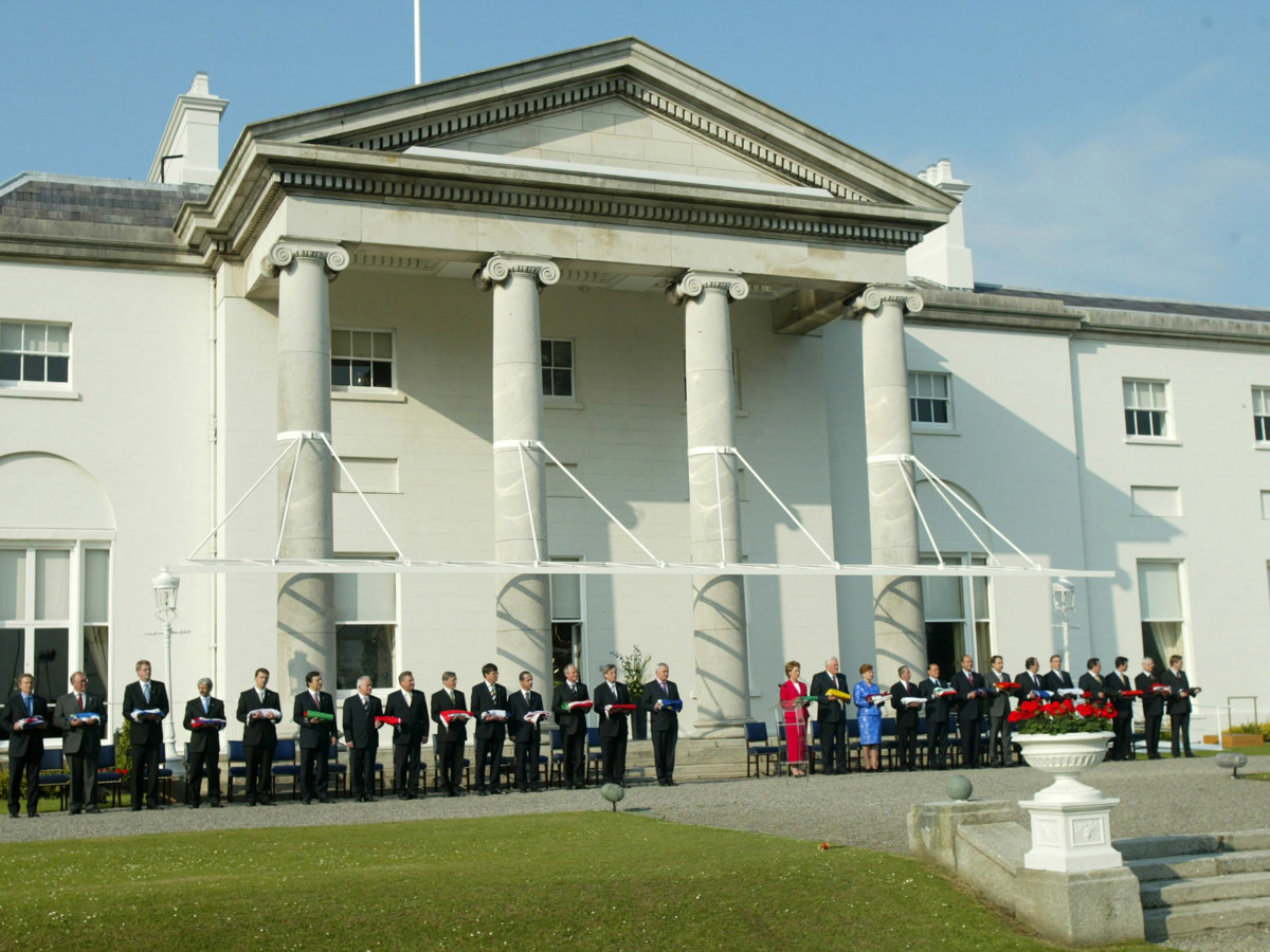 Photo of Irish and European political leaders standing in front of the Irish Presidential residence, Áras an Uachtaráin.
